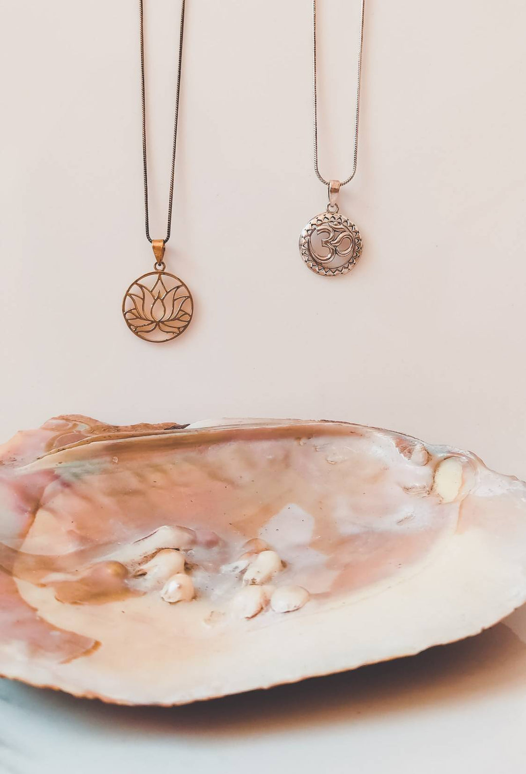 gold-lotus-flower-and-silver-om-necklace.jpg