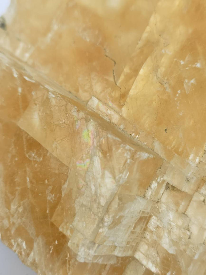 yellow-rhombohedron-optical-honey-calcite-with-rainbows.jpg