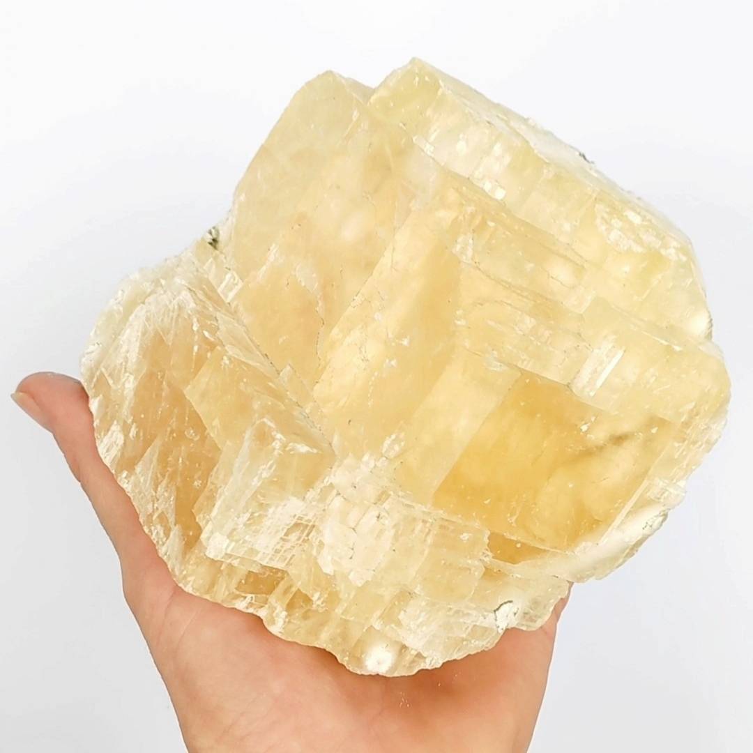 yellow-rhombohedron-optical-honey-calcite-with-rainbows.jpg