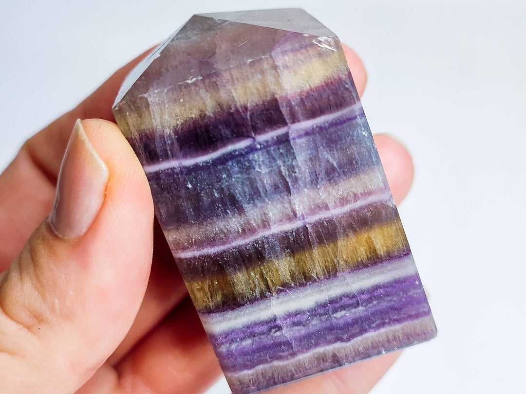 banded-rainbow-fluorite-crystal-specimen.jpg