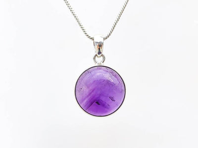 round-amethyst-crystal-pendant-necklace.jpg